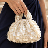 Tulle écru à reflets nacrés et tissu à sequins en forme de pétales - Ribes y Casals