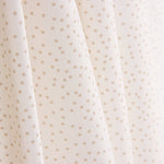 Popeline de coton à pois beiges sur fond blanc - Ribes y Casals