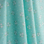 Percal imprimé bouquets blanc vert eau - Ribes y Casals