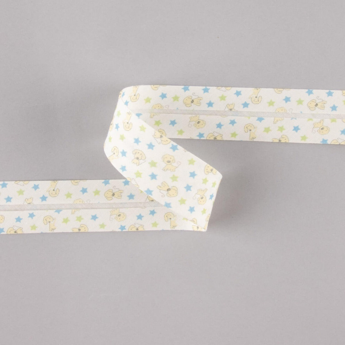 Biais en coton biologique chiots étoiles bleu-vert 30 mm - Ribes y Casals