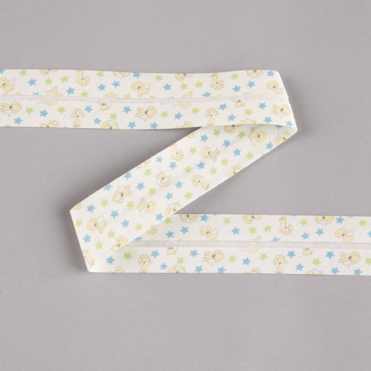 Biais en coton biologique chiots étoiles bleu-vert 30 mm - Ribes y Casals