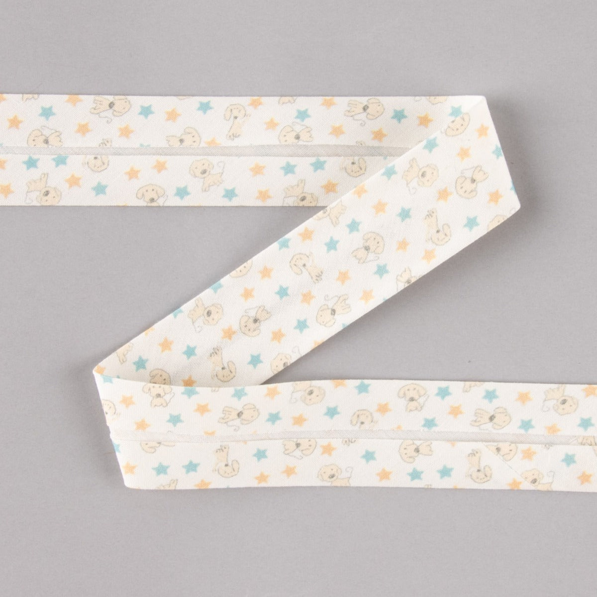 Biais en coton biologique chiots étoiles bleu-orange 30 mm - Ribes y Casals