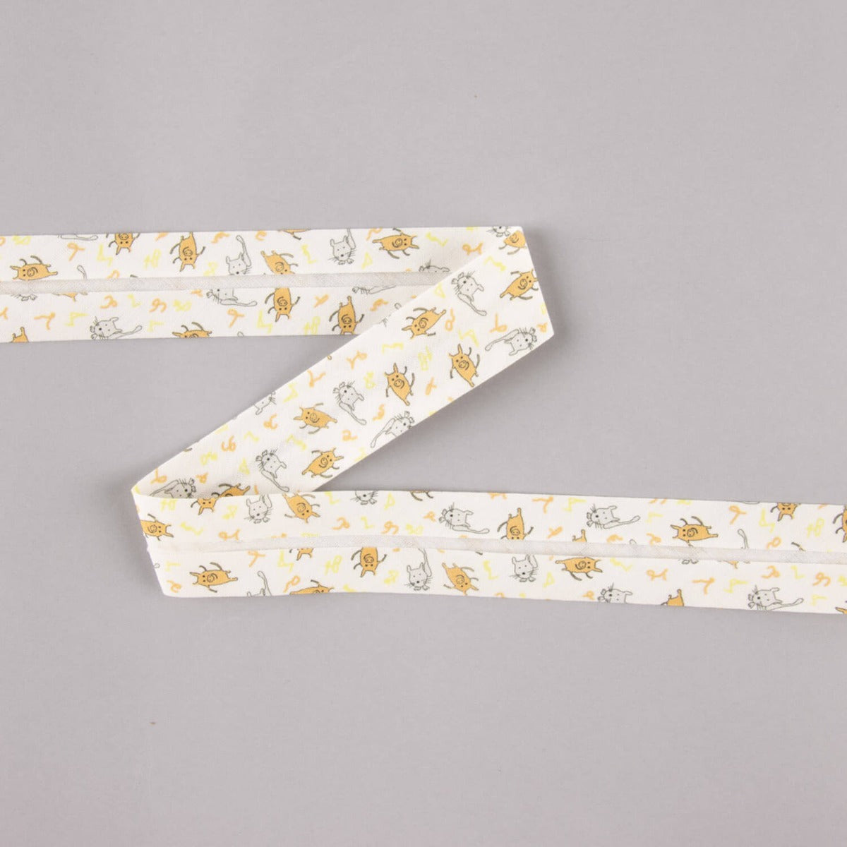 Biais en coton biologique porcelets et chatons orange-gris 18 mm - Ribes y Casals