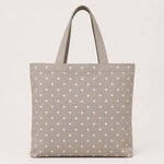 Toile imprimée à pois blancs sur fond beige - Ribes y Casals