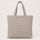 Toile imprimée à pois blancs sur fond beige - Ribes y Casals