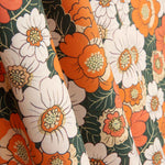 Popeline de coton imprimée fleurs rétro orange - Ribes y Casals