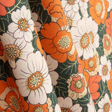 Popeline de coton imprimée fleurs rétro orange - Ribes y Casals