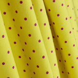 Gabardine extensible à pois 3 mm citron vert-bougainvillier - Ribes y Casals