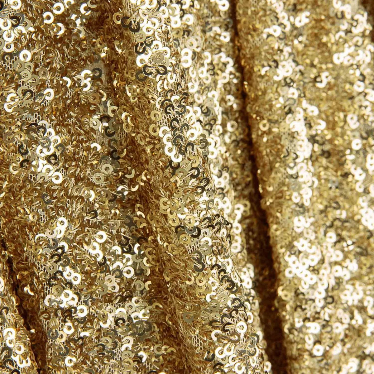 Tissu Lycra à paillettes dorées sur tulle élastique - Ribes y Casals